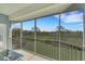 Screened balcony overlooking a lush green landscape at 3919 Cape Haze Dr # 506, Rotonda West, FL 33947
