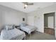 Guest bedroom with two twin beds and access to hallway at 3919 Cape Haze Dr # 506, Rotonda West, FL 33947