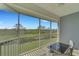 Relaxing screened balcony with outdoor seating and nature views at 3919 Cape Haze Dr # 506, Rotonda West, FL 33947