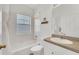 Bathroom with tub, toilet and a vanity with sink at 3919 Cape Haze Dr # 506, Rotonda West, FL 33947