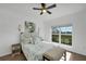 Bright bedroom with a queen-size bed and wood floors at 3919 Cape Haze Dr # 506, Rotonda West, FL 33947