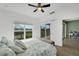 Bedroom with sliding glass doors leading to a balcony and view of nature at 3919 Cape Haze Dr # 506, Rotonda West, FL 33947