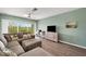 Living room with sectional sofa and wood-look floors at 3919 Cape Haze Dr # 506, Rotonda West, FL 33947