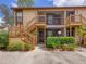 Two-story building with wooden stairs and landscaping at 5769 Avista Dr # 5769, Sarasota, FL 34243