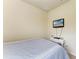 Cozy bedroom featuring a wall-mounted TV and neutral decor for a relaxing ambiance at 6547 Willowshire Way, Bradenton, FL 34212