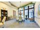Bright conference room with large windows, seating for six, and presentation technology at 6547 Willowshire Way, Bradenton, FL 34212