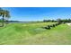 Well-maintained driving range with multiple hitting bays overlooking a serene lake at 6547 Willowshire Way, Bradenton, FL 34212