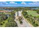 An aerial view of a gated entrance to a residential neighborhood on a sunny day at 6547 Willowshire Way, Bradenton, FL 34212