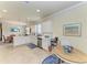 Bright eat-in kitchen features white cabinetry, modern appliances, and tile flooring at 6547 Willowshire Way, Bradenton, FL 34212