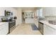 Bright kitchen features white cabinets, stainless steel appliances, and lots of counter space at 6547 Willowshire Way, Bradenton, FL 34212