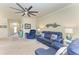 Comfortable living room with blue furniture, stylish decor, and neutral walls at 6547 Willowshire Way, Bradenton, FL 34212