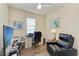 Functional office space with desk, chair, and comfortable recliner; perfect for work and relaxation at 6547 Willowshire Way, Bradenton, FL 34212
