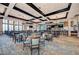 Spacious restaurant and bar area with elegant lighting, comfortable seating and golf course views at 6547 Willowshire Way, Bradenton, FL 34212