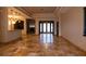 Spacious living room with tile floors and a view into the foyer at 6935 74Th Street E Cir, Bradenton, FL 34203