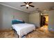Spacious bedroom with king-size bed and bathroom access at 6935 74Th Street E Cir, Bradenton, FL 34203