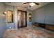 Sunroom with tile floors, French doors, and a built-in media console at 6935 74Th Street E Cir, Bradenton, FL 34203