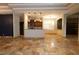 Open kitchen with island, stainless steel appliances, and tile flooring at 6935 74Th Street E Cir, Bradenton, FL 34203