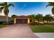 Beautiful single-Gathering home with a brick driveway and landscaping at 6935 74Th Street E Cir, Bradenton, FL 34203