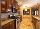 Kitchen with stainless steel appliances and granite countertops at 6935 74Th Street E Cir, Bradenton, FL 34203