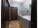 Laundry room with washer, dryer, and built-in shelving at 6935 74Th Street E Cir, Bradenton, FL 34203
