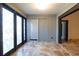 Bright sunroom with tile floors, French doors, and access to the outdoors at 6935 74Th Street E Cir, Bradenton, FL 34203