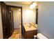 Well-appointed bathroom with double vanity and tile flooring at 6935 74Th Street E Cir, Bradenton, FL 34203