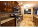 Kitchen with stainless steel appliances and granite countertops at 6935 74Th Street E Cir, Bradenton, FL 34203