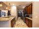 Kitchen with island, stainless steel appliances, and granite countertops at 6935 74Th Street E Cir, Bradenton, FL 34203