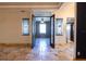 Living room with tile flooring and double doors at 6935 74Th Street E Cir, Bradenton, FL 34203