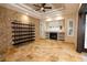 Living room featuring a fireplace, built-in shelving, and tile floors at 6935 74Th Street E Cir, Bradenton, FL 34203