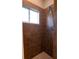 Shower stall with brown tile surround at 6935 74Th Street E Cir, Bradenton, FL 34203
