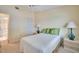 This bedroom features serene wall colors, a ceiling fan, and ensuite bathroom access at 7201 29Th Avenue W Dr # 309, Bradenton, FL 34209