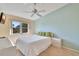 Bright bedroom featuring carpet floors, ceiling fan, and window at 7201 29Th Avenue W Dr # 309, Bradenton, FL 34209