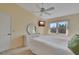 Comfortable bedroom with large window, natural light, and ceiling fan at 7201 29Th Avenue W Dr # 309, Bradenton, FL 34209