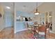 Cozy dining area with laminate flooring, pendant lighting, and four chairs at 7201 29Th Avenue W Dr # 309, Bradenton, FL 34209