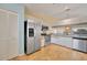 Bright kitchen with stainless steel appliances, granite countertops, and travertine flooring at 7201 29Th Avenue W Dr # 309, Bradenton, FL 34209