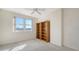 Bright bedroom with two large windows and bookcases at 750 N Tamiami Trl # 504, Sarasota, FL 34236