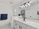 Clean bathroom, featuring a white vanity and updated fixtures at 6670 Glacier Ave, North Port, FL 34291