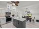 Kitchen with island, grey cabinets and white countertops at 6670 Glacier Ave, North Port, FL 34291