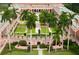 Lush courtyard with tropical plants and a central statue at 1570 Pleasant Rd # J-26, Bradenton, FL 34207
