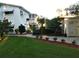 Building exterior with manicured lawn and walkway at 1570 Pleasant Rd # J-26, Bradenton, FL 34207