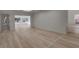 Open concept living room with light hardwood floors and lots of natural light at 2303 89Th Nw St, Bradenton, FL 34209