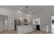 Modern kitchen with white cabinets, quartz countertops and a large island at 2303 89Th Nw St, Bradenton, FL 34209