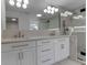 Elegant bathroom featuring a double vanity, marble countertops, and a large mirror at 2303 89Th Nw St, Bradenton, FL 34209