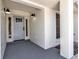 Newly renovated home with a light gray front door and tiled flooring at 2303 89Th Nw St, Bradenton, FL 34209