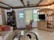 Living room featuring a rocking chair and built-in shelving at 5268 Boca Raton Ave, Sarasota, FL 34234