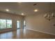 Spacious dining room with tile floors and modern light fixture at 890 Indus Rd, Venice, FL 34293