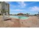 Resort-style pool with ample deck space and beach access at 1241 Gulf Of Mexico Dr # 708, Longboat Key, FL 34228