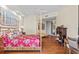 Spacious bedroom with hardwood floors and a four-poster bed at 1241 Gulf Of Mexico Dr # 708, Longboat Key, FL 34228