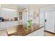 Modern kitchen with granite countertops, white cabinets, and stainless steel appliances at 1241 Gulf Of Mexico Dr # 708, Longboat Key, FL 34228